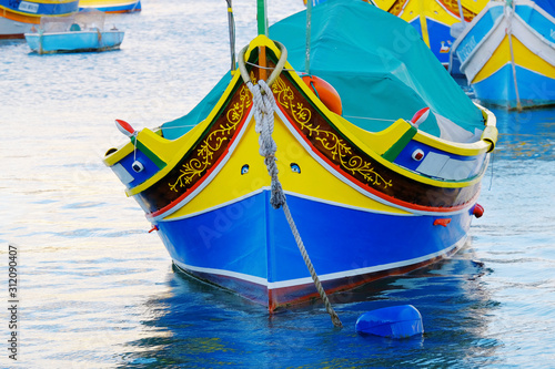 Detail view of the colorful boat luzzi with Eye of Osiris in Marsaxlokk, Malta. photo