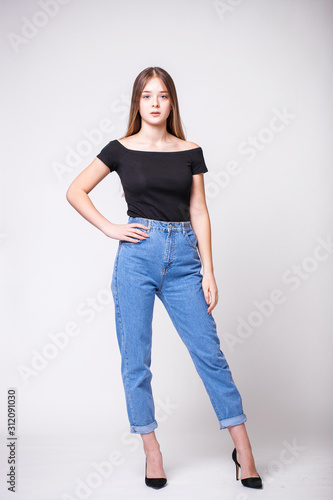 Beautiful girl in blue jeans © Andrey_Arkusha
