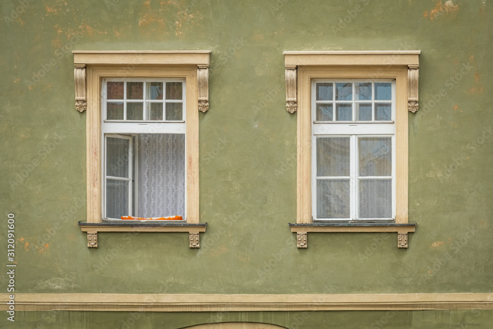 Green facade of the old house. The Windows and decoration of walls in Litomerice, Czechia
