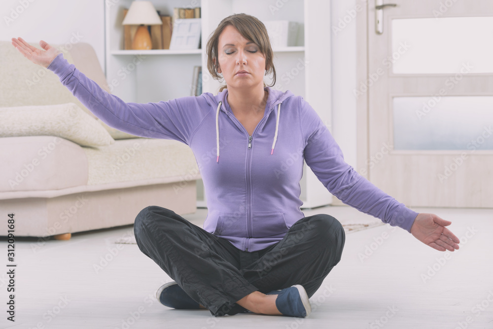Woman doing qi gong tai chi exercise Woman doing qi gong tai chi exercise