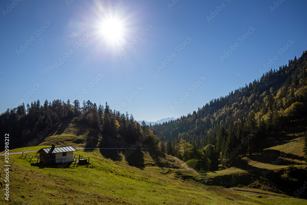 sun over hut in the mountains german alps sun over hut in the mountains german alps