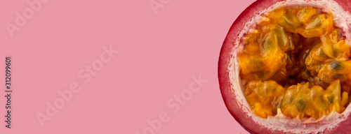 Passion fruit on a pink background, close-up, isolated, top view