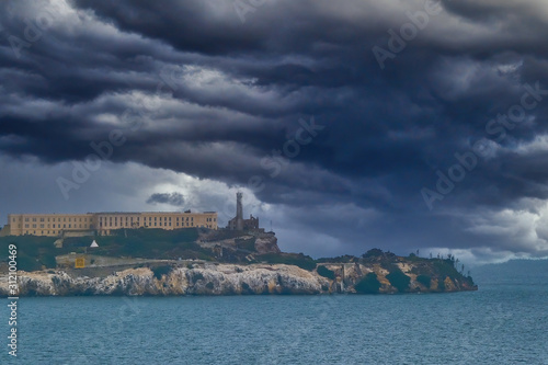 Alcatraz Under Stormy Clouds in San Francisco Bay © dbvirago
