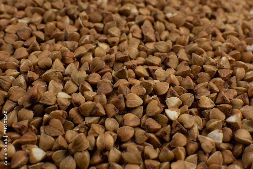 Background and texture of Buckwheat. Roasted buckwheat. Garnish. Ingredient. Dietary product. Background and texture of Buckwheat. Roasted buckwheat. Garnish. Ingredient. Dietary product.