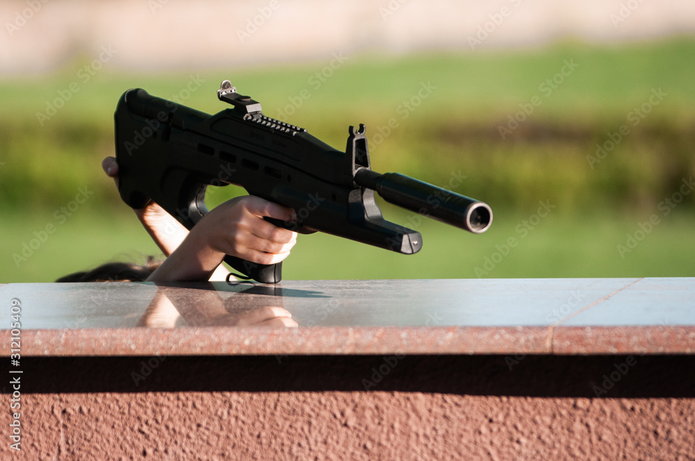 arm with gun arm with gun