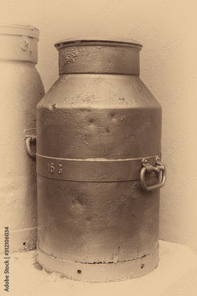 An Old Milk Churn in Sepia with Vignette An Old Milk Churn in Sepia with Vignette