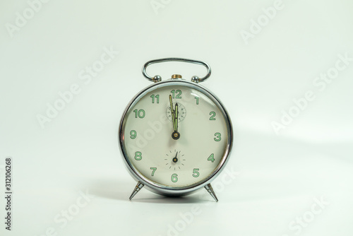 old metal analog clock isolated on White background photo