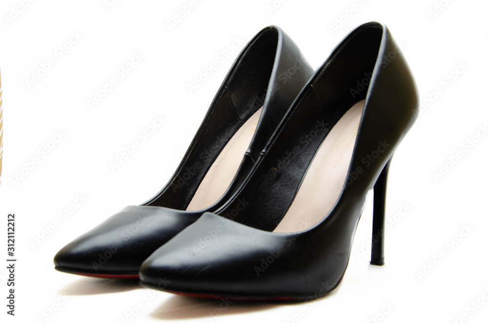 Women's shoes in black with a red sole on a white background. Shoes for the holiday, office shoes. High-heeled shoes, stilettos. Women's shoes close-up. Women's shoes in black with a red sole on a white background. Shoes for the holiday, office shoes. High-heeled shoes, stilettos. Women's shoes close-up.