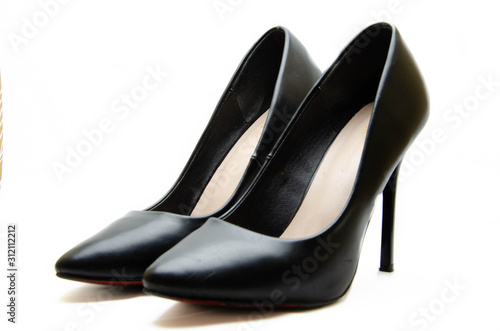 Women's shoes in black with a red sole on a white background. Shoes for the holiday, office shoes. High-heeled shoes, stilettos. Women's shoes close-up.