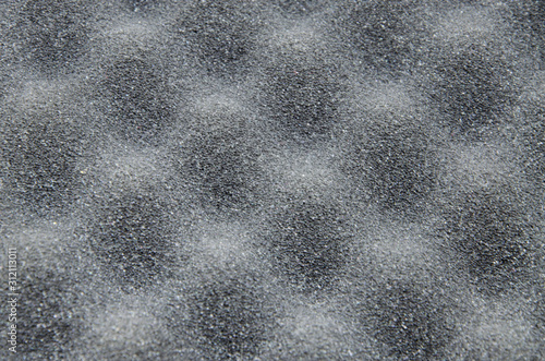 Foam rubber. Professional soundproofing for audio and video recording studios. Soundproof paralon on a white background, in macro. Soundproofing texture background for studio