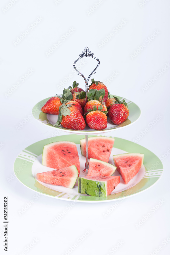 Fruit bowl centerpiece; photo on wooden background. Fruit bowl centerpiece; photo on wooden background.
