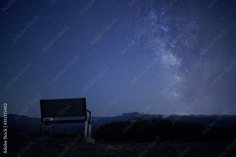 Photograph of the Milky Way from a bench on top of a mountain in Güejar Sierra, Granada, Spain Photograph of the Milky Way from a bench on top of a mountain in Güejar Sierra, Granada, Spain