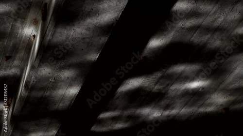 Surreal clip of moving water reflected on a dark ceiling