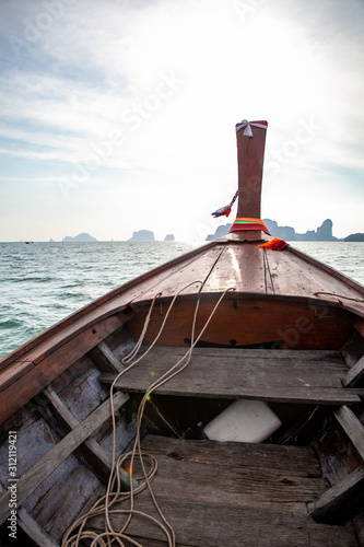 Sitting inside a Thai long tail boat heading to Railay Beach in Krabi, Thailand