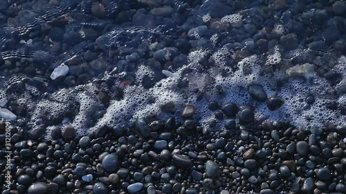  black beach pebble waves sea