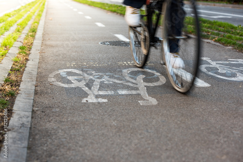 Photography Detail photograph of the Barcelona bike lane symbol with a cyclist in movement