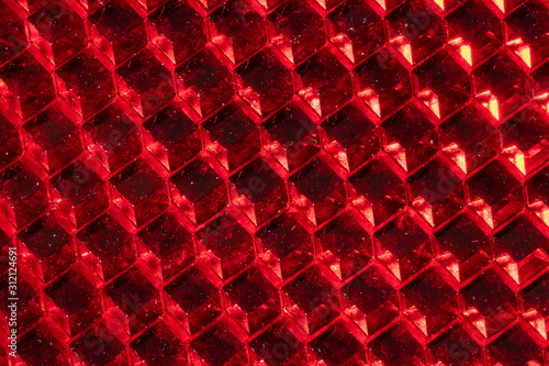 A close up abstract macro photo of a plastic orange reflector photo