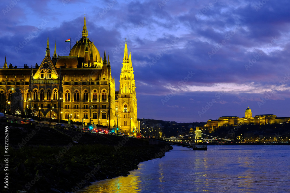 Panoramic view on illuminated Budapest parliament on Danube river, Chain bridge and Buda castle at night