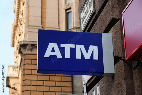 ATM cash machine sign on the street