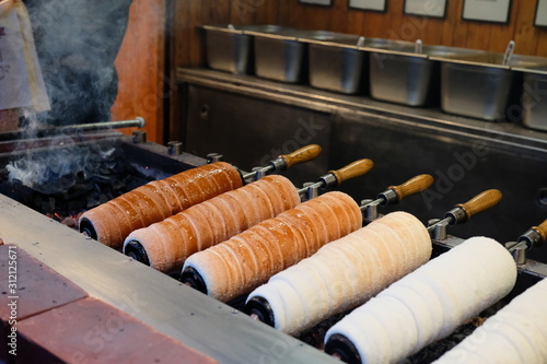 Photography Hungarian traditional street food at advent Christmas market, baking pastry kurt