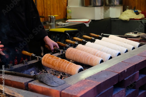 Trdelnik bakery on the street market in Prague, Czech Republic photo