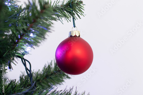 Colorful and sparkling decorations for the Christmas tree. Christmas decorations during the holidays with colored balls and lights. Sample typical photo for family Christmas. Santa Claus night