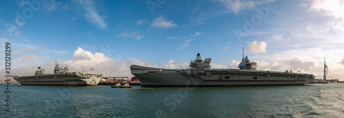 The Royal Navys aircraft carriers HMS Queen Elizabeth and HMS Prince of Wales docked at Portsmouth, England