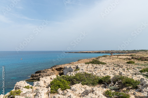 Curved rocky seashore and transparent water of Mediterranean sea © Blue Cat Studio