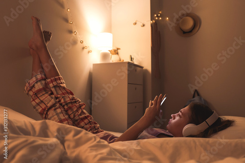 Teenage girl with mobile ph...