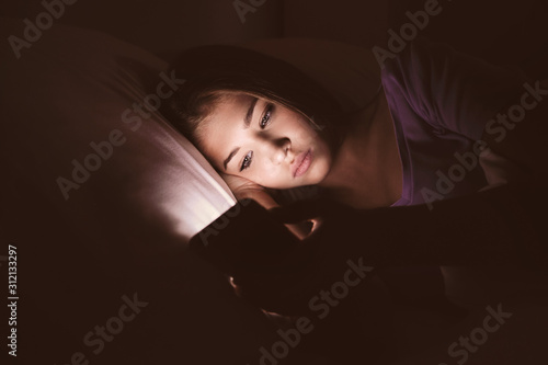 Teenage girl with mobile ph...