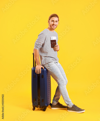 Young tourist with luggage ...