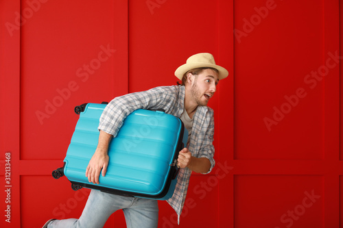 Hurrying male tourist with ...