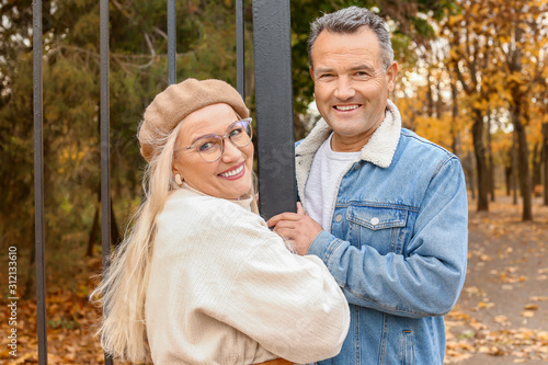 Happy mature couple in autu...