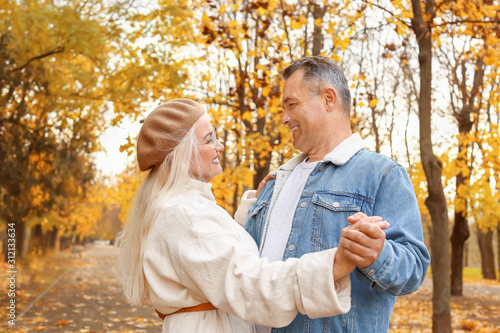 Happy mature couple dancing...