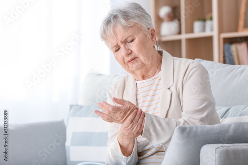 Senior woman suffering from...