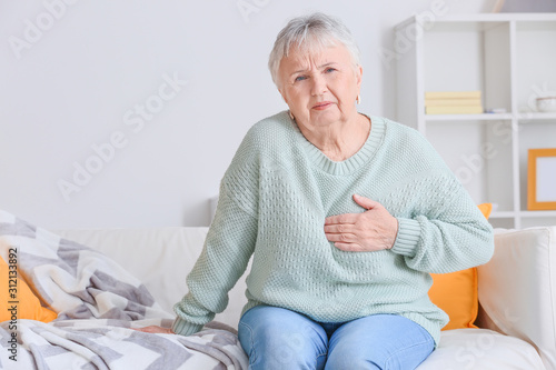 Senior woman suffering from...