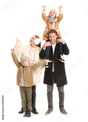 Happy family in winter clot...