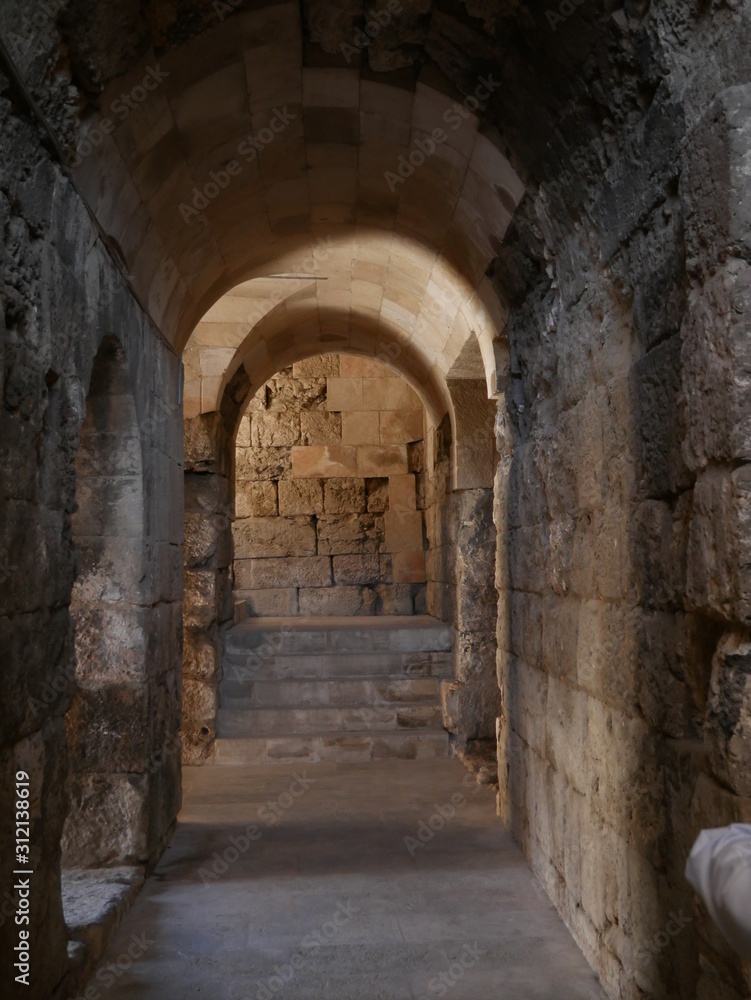 Stone arch in the Roman theatre of Amman, Jordan, ancient historic monumental building in the Middle East