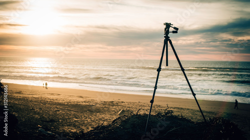 A tripod at a Californian beach during golden hour  photo