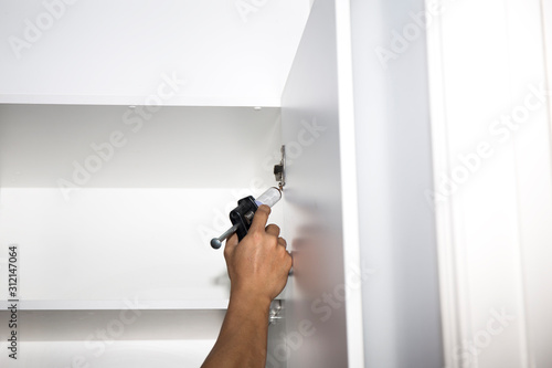 Pest Control Worker Spraying Pesticide inside the house