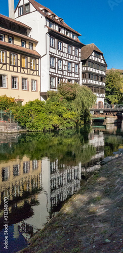 timber framed houses and their reflections in the Strasbourg canal
