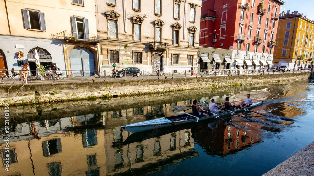 Rowers along the Naviglio Grande in Milan, Italy