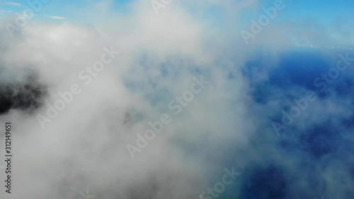 Revealing beautiful mountain peaks in Hawaii - Cloudy Nature Aerial near Kanapali beach on Kauai photo