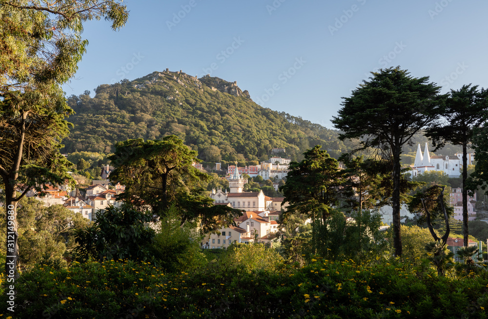 Sunset view of the Portuguese town of Sintra with the Moorish fortress on the hilltop above the city