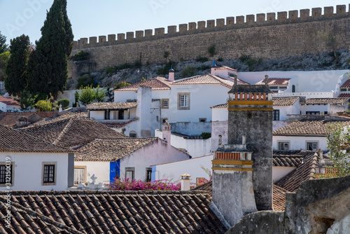 Rooftop view to the city walls in the old medieval city of Obidos in Portugal