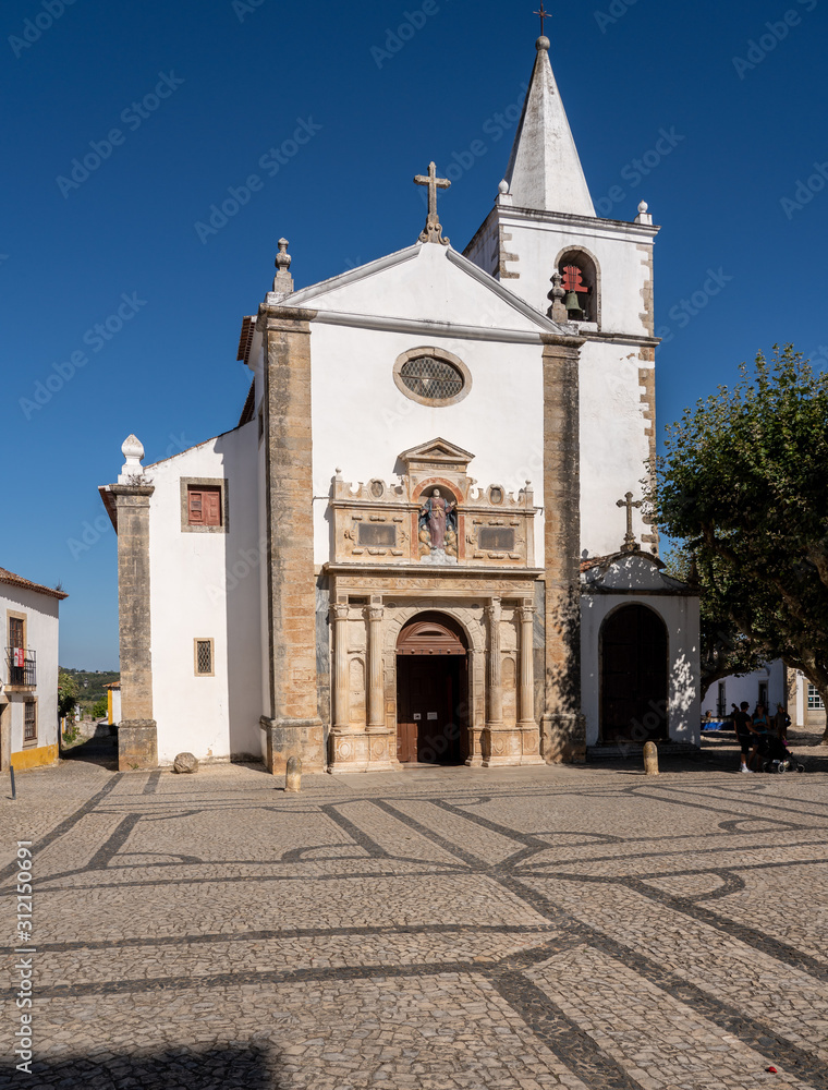 Fototapeta premium Main entrance into the Igreja de Santa Maria in the old medieval walled city of Obidos in Portugal