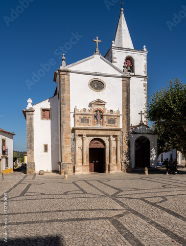 Main entrance into the Igreja de Santa Maria in the old medieval walled city of Obidos in Portugal