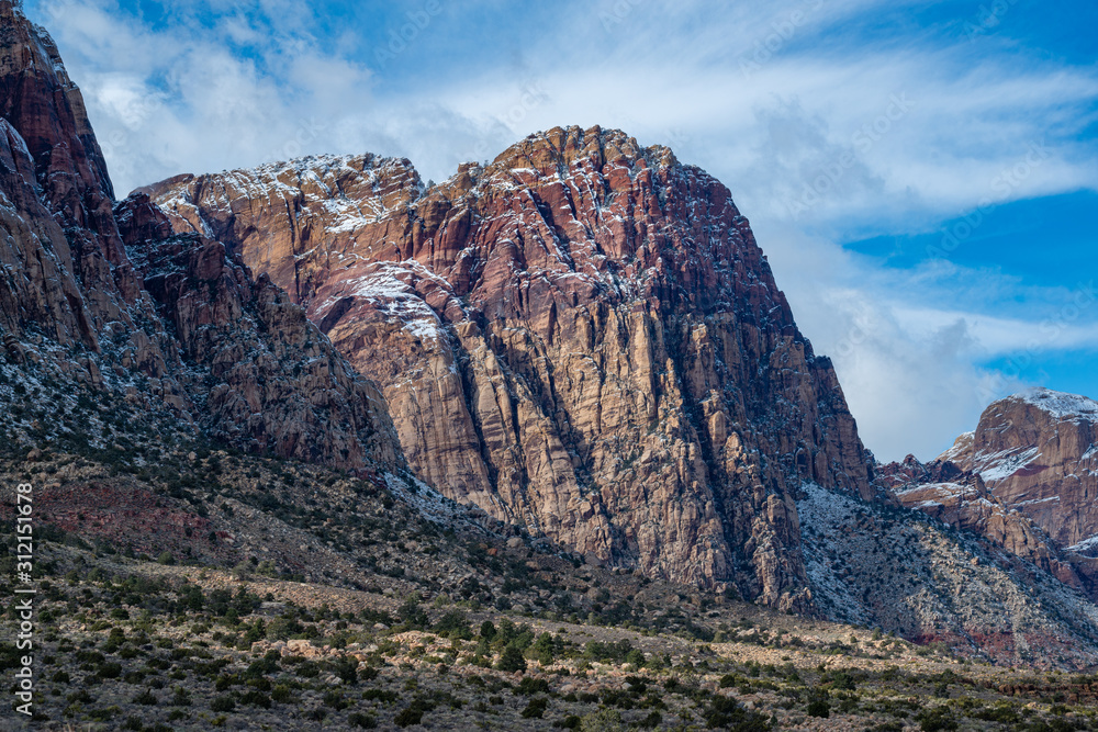 USA, Nevada, Clark County, Red Rock Canyon National Conservation Area. The South Face of Rainbow Mountain covered with spots of snow.