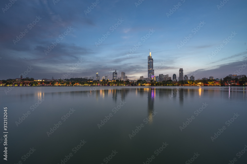 illuminated city waterfront downtown skyline, Nanjing, China.