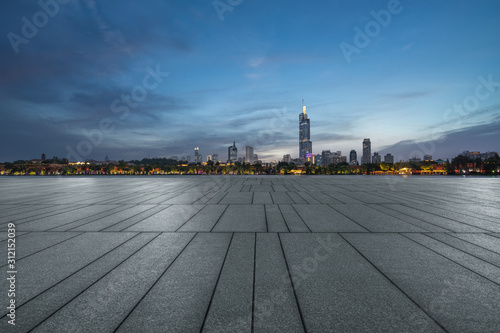 Panoramic skyline and buildings with empty square floor at dusk © hallojulie